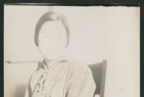 woman sitting in a chair (ddr-densho-378-697)