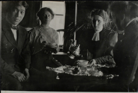 Three women and a man having tea (ddr-densho-355-587)