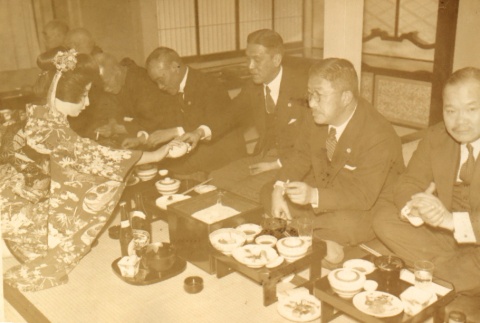 Men seated at dinner (ddr-njpa-4-79)