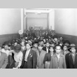 Indonesian men at the immigration detention facility in San Francisco waiting to be transported to the immigration detention facility in Crystal City, Texas (ddr-csujad-27-8)