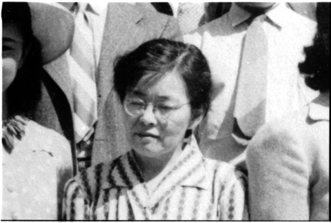 Woman in crowd (ddr-densho-1007-1275)