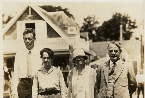 Charles and Anne Lindbergh standing on a dock with the Morrows (ddr-njpa-1-1180)