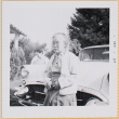 Woman standing by car (ddr-densho-522-428)