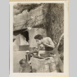 Man shaving outside bunker (ddr-densho-466-303)