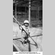 Little boy with a big rake (ddr-ajah-6-409)