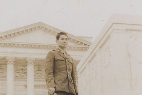 Soldier standing in front of monument (ddr-janm-17-9)