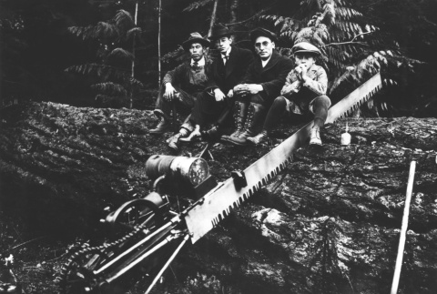 Three men and a boy sitting on a logged tree (ddr-densho-34-21)
