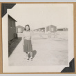 Young woman outside barracks (ddr-densho-542-239)