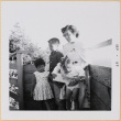 Yoshiko, William, Leslie and Susan by fence (ddr-densho-522-564)