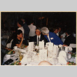 Three people at banquet table (ddr-densho-466-546)