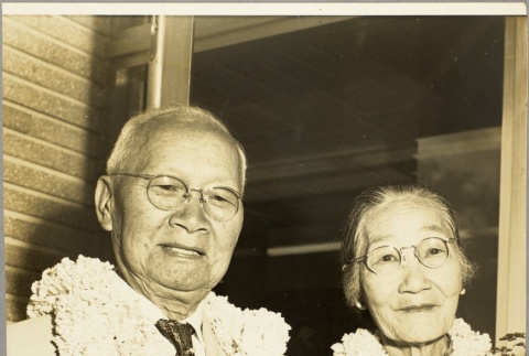 C.K. Ai and his wife wearing leis (ddr-njpa-2-6)