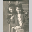 Two women outside barracks (ddr-densho-522-666)