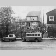 Nuns and children standing outside building with Maryknoll buses (ddr-densho-330-247)