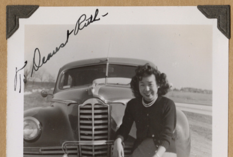 Yuchi posing with a car (ddr-densho-542-341)