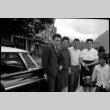 Two women, two men and a boy standing by car (ddr-densho-426-2400)
