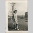 Woman leaning against a tree (ddr-manz-10-48)