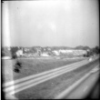 View toward buildings from road (ddr-densho-377-1504)