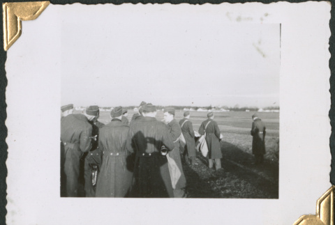 Men in uniform standing in field (ddr-densho-434-69)