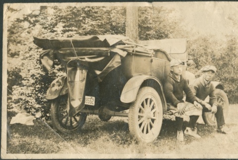 Two men seated on a car (ddr-densho-321-772)