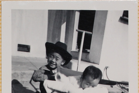 Susan Shiomi in stroller with William Shiomi in cowboy hat (ddr-densho-522-134)