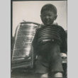 Boy standing in front of car (ddr-densho-523-112)