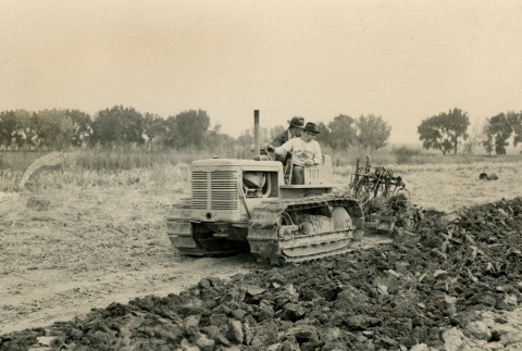 Japanese American on a tractor (ddr-densho-159-93)