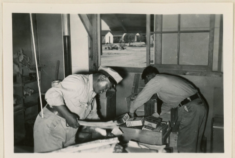 Two workers checking baggage (ddr-densho-37-884)