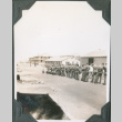 Group of men lined up outside building (ddr-ajah-2-108)