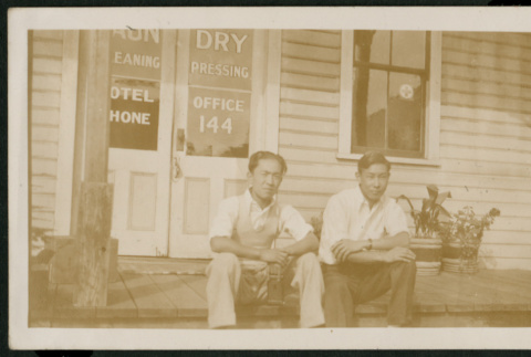 Two men in front of dry cleaners (ddr-densho-359-127)