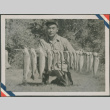 Masao Sakagami holding fish (ddr-densho-201-950)