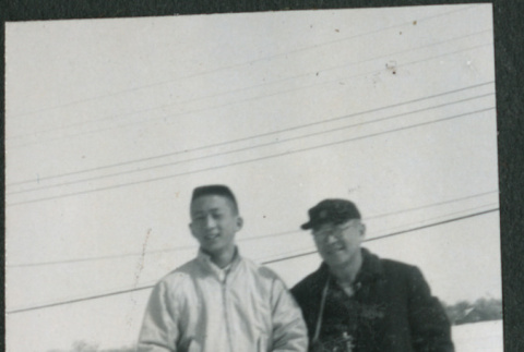 Two men standing in snow (ddr-densho-523-363)