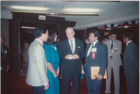 Group talking at the 1986 JACL Convention (ddr-densho-10-55)
