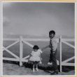 Susan and William Shiomi by fence (ddr-densho-522-302)