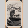 Photo of an elderly woman with a car (ddr-densho-483-472)
