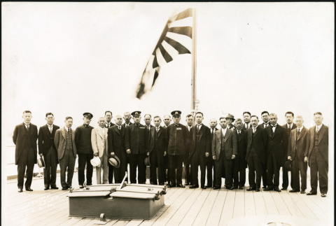 Seiso Bitow and others stand on the deck of a Japanese naval ship (ddr-densho-395-85)