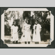 three women in front of a large tree (ddr-densho-378-605)