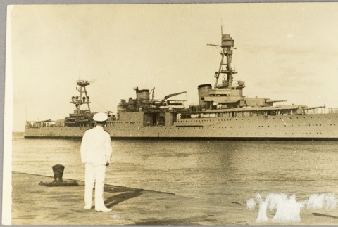 Navy officer looking at the USS Houston (ddr-njpa-13-60)