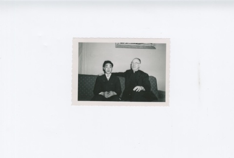 (Photograph) - Image of priest and man sitting on couch (ddr-densho-330-289-master-fb74257a49)