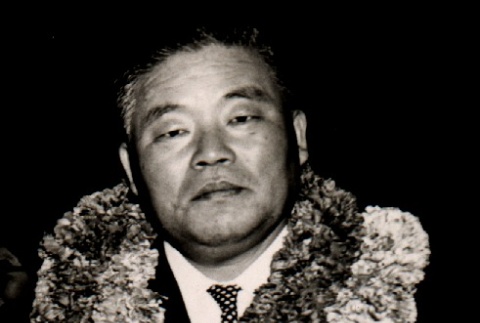 Man wearing leis (ddr-njpa-4-1683)