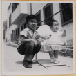 Susan Shiomi in bouncy chair, with William Shiomi (ddr-densho-522-157)