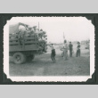 Men loading into a truck (ddr-densho-471-34)