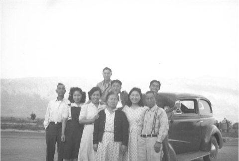 Group of Japanese Americans in front of a car (ddr-densho-153-341)