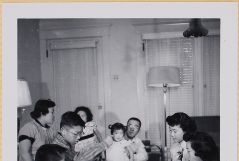 Group playing Monopoly (ddr-densho-522-551)