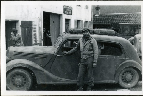 Nisei soldier in front of a car (ddr-densho-164-26)