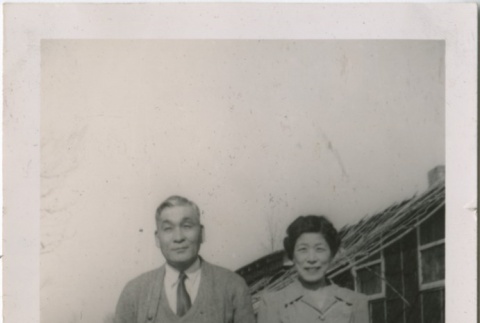 Couple stands outside at camp (ddr-densho-321-49)