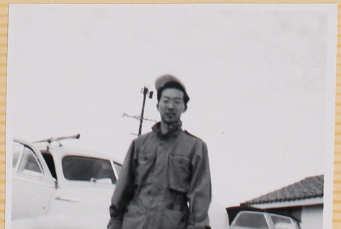 Hardy Shiomi standing next to car (ddr-densho-522-313)