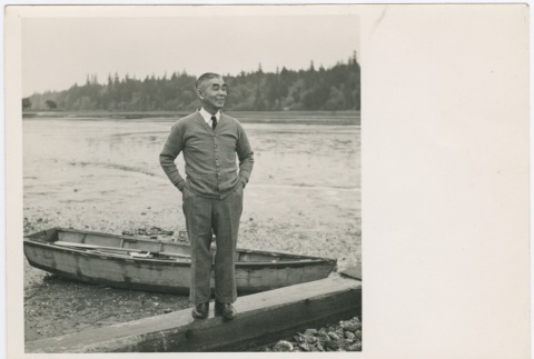 Man standing in front of boat (ddr-densho-332-33)