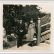 Man and woman standing by stairs in garden (ddr-densho-426-2139)