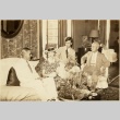 A group of people sitting in a living room (ddr-njpa-1-1483)