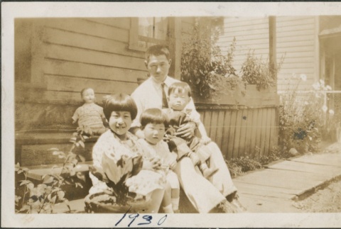Family in front of a house (ddr-densho-321-664)